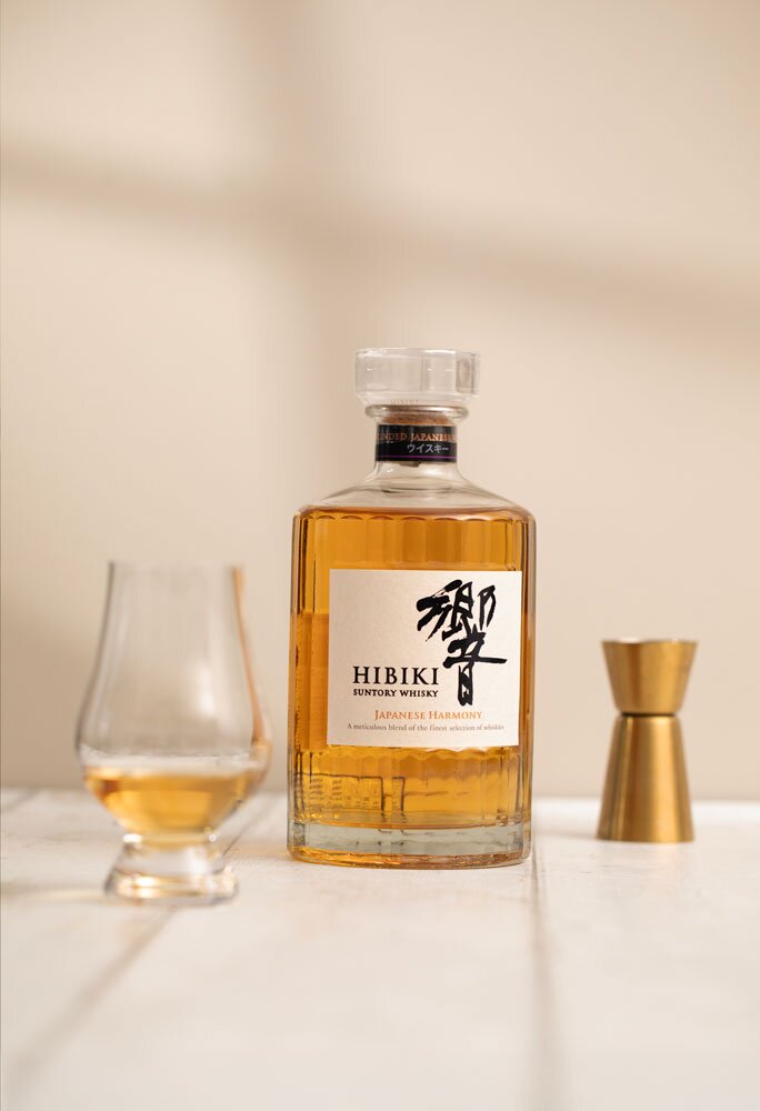 Hibiki Japanese Harmony whisky bottle with Glencairn glass and jigger