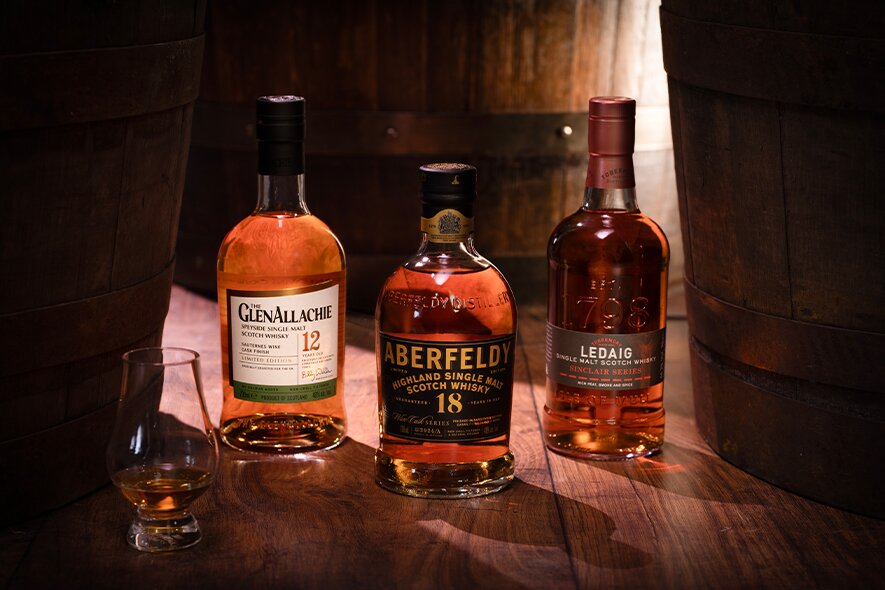 Three bottles of wine cask finished whisky from GlenAllachie, Aberfeldy and Ledaig.