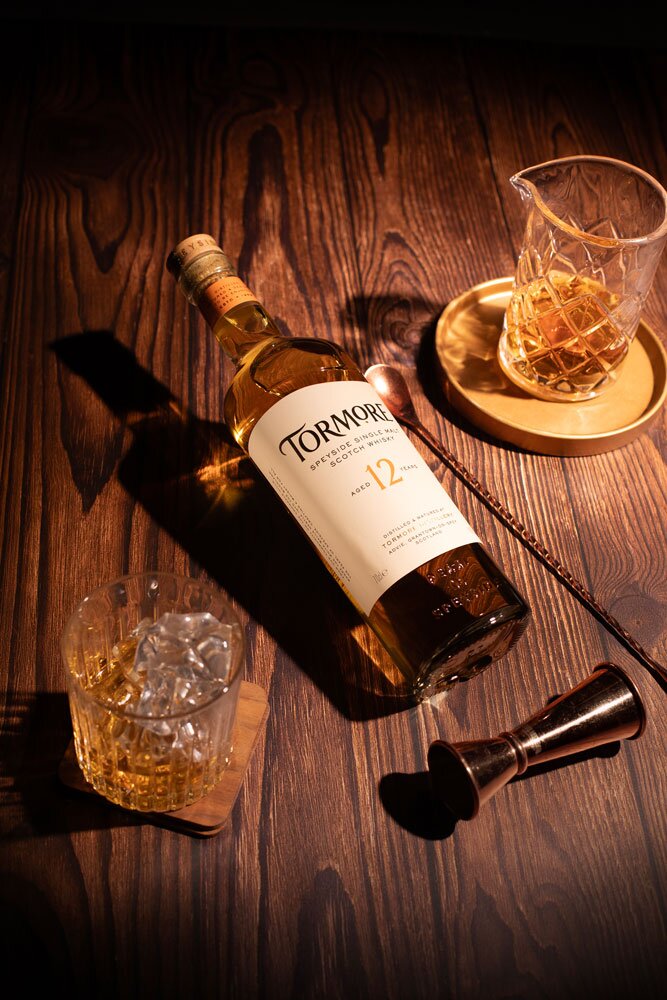 Tormore 12 Year Old whisky bottle with glass and barware