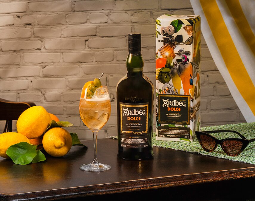 A bottle of Del Maguey Mezcal Vida next to a negroni cocktail.