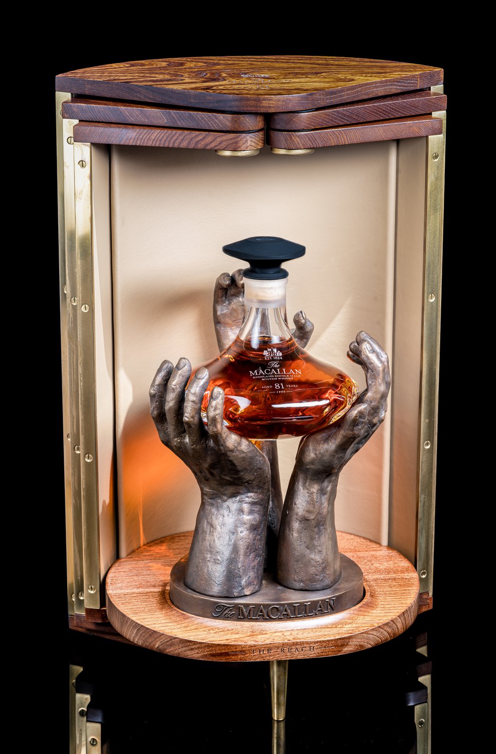Macallan Reach whisky with bronze stand and wooden cabinet packaging