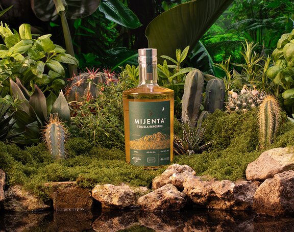 A bottle of Mijenta Tequila Reposado