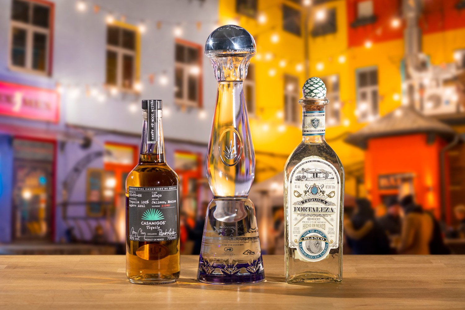 3 bottles of Tequila on a bokeh blurred background