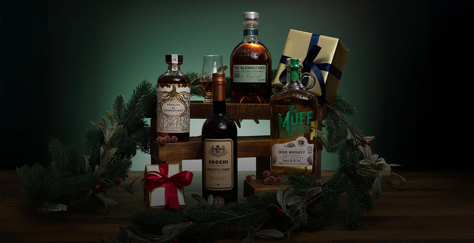 A range of bottles on a green Christmas background