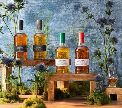 Tobermory & Ledaig whisky bottles surrounded by thistles