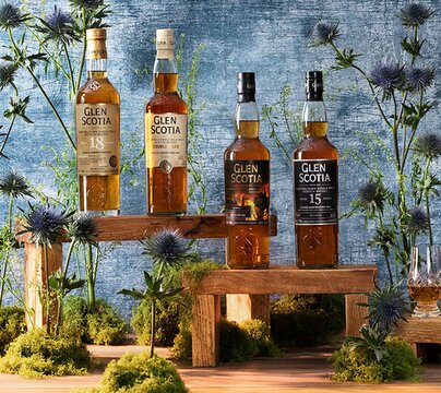 Glen Scotia whisky bottles surrounded by thistles