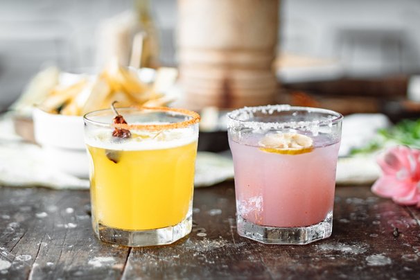 How to drink tequila, two bright coloured Tequila shots.