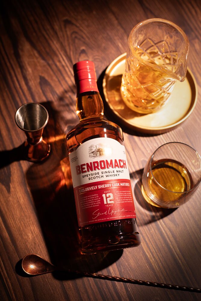 Benromach 12 Year Old whisky bottle with glass and barware