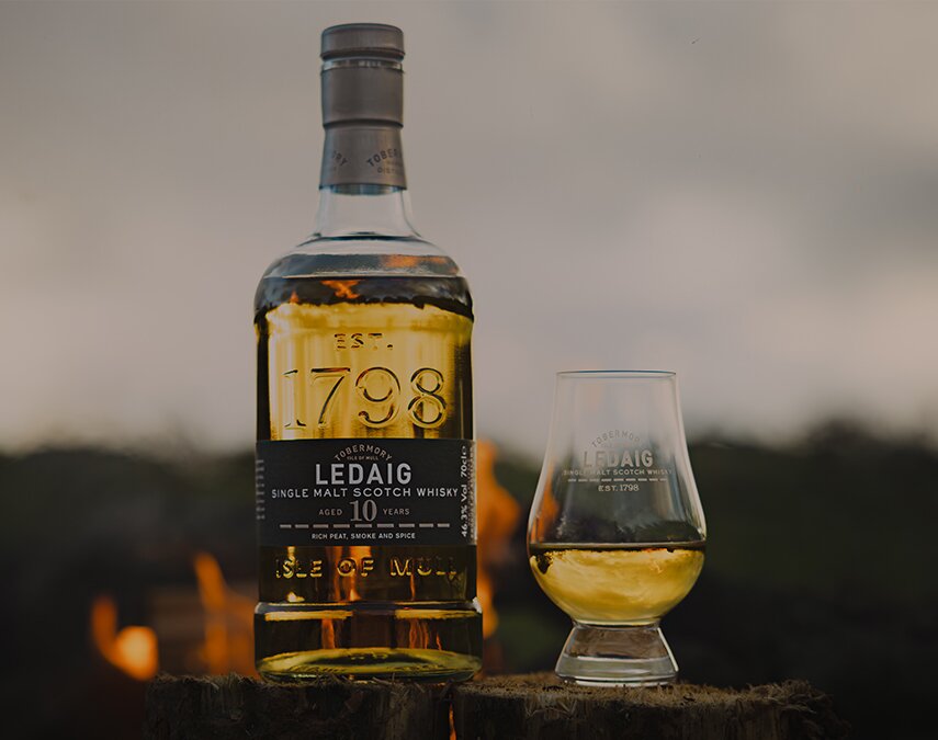 A bottle of Ledaig 10 Year Old with a dram of whisky
