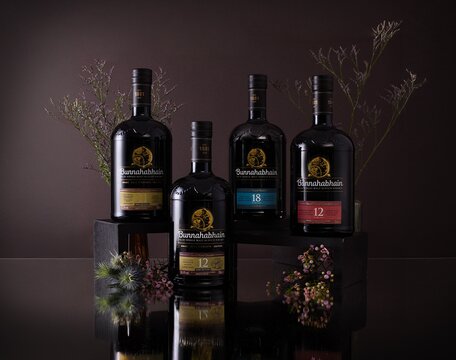 Bunnahabhain whisky bottles surrounded by thistles.