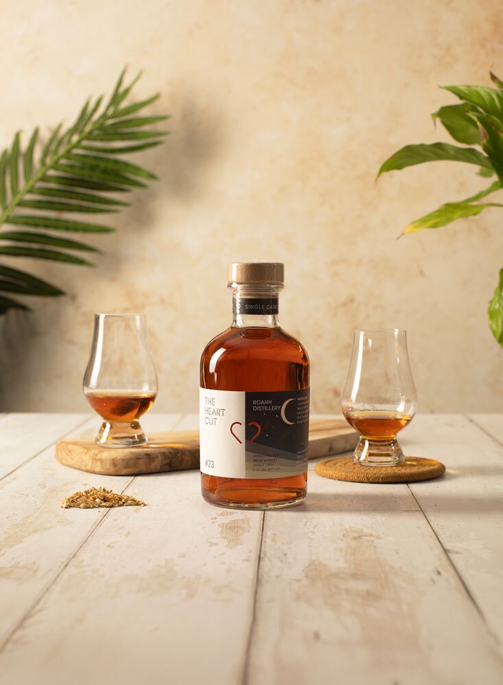 Boann The Heart Cut #23 whisky bottle with two tasting glasses