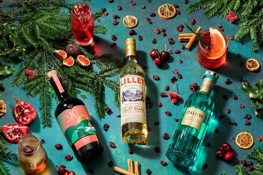 3 Bottles of Liqueurs on a festive background