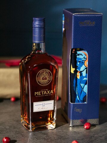A bottle of Metaxa 12 Stars gift set with socks