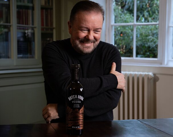Ricky Gervais with a bottle of Dutch Barn Vodka.