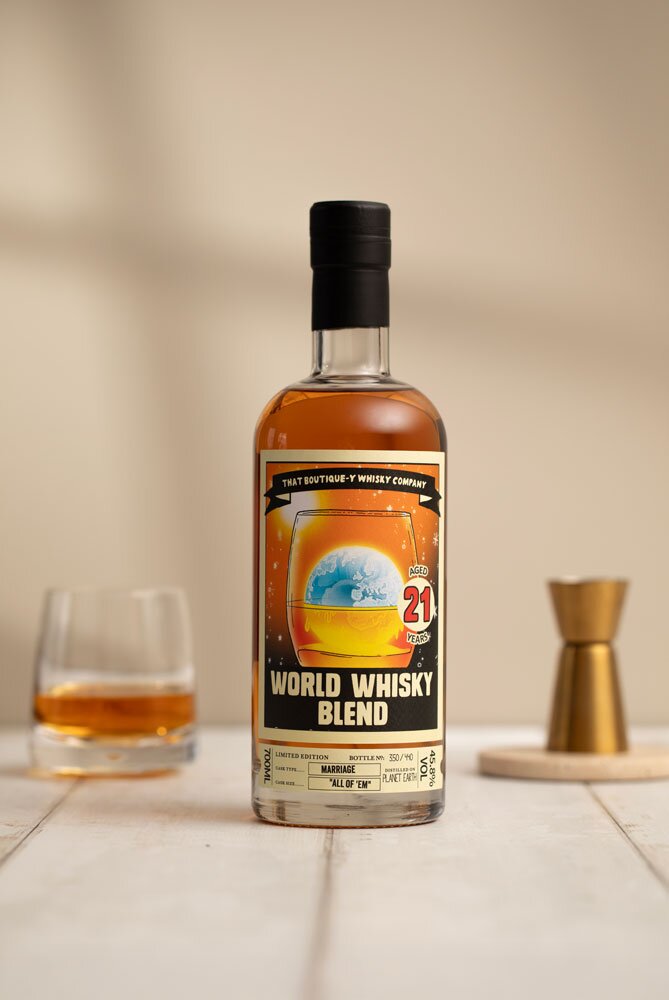 World Whisky Blend 21 Year Old (That Boutique-y Whisky Company) whisky bottle in front of tumbler glass and jigger