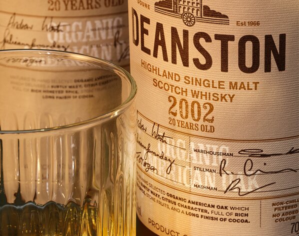 Bottle of Deanston 20 Year Old 2002 Organic Whisky with presentation tube and glass