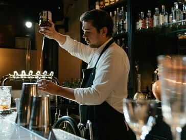 A bar with a selection of bottles