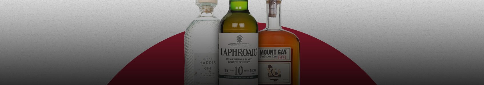 Five bottles of Douglas Laing whisky on colourful backgrounds.