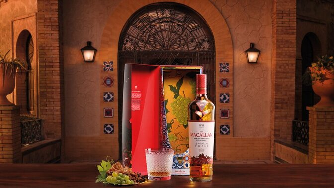 A bottle of The Macallan A Night on Earth in Jerez in a Spanish setting with food and the presentation box
