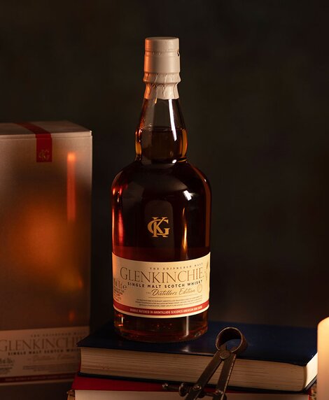 A bottle of Glenkinchie 2007 Distillers Edition whisky against a dark background and it's presentation box. 