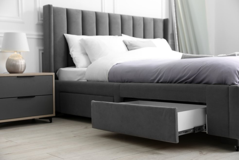 Bed with a storage drawer built into the platform