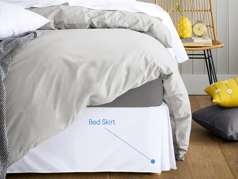 Bed with white bed skirt