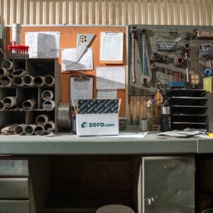 Work desk and bulleting board with tools hanging on the wall