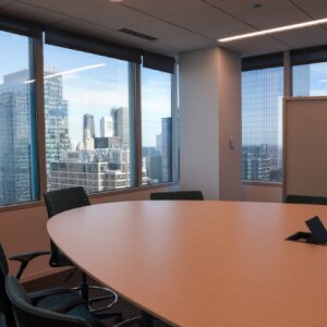 Table and chairs in a corporate meeting room in a tall building