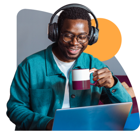 man drinking coffee at laptop