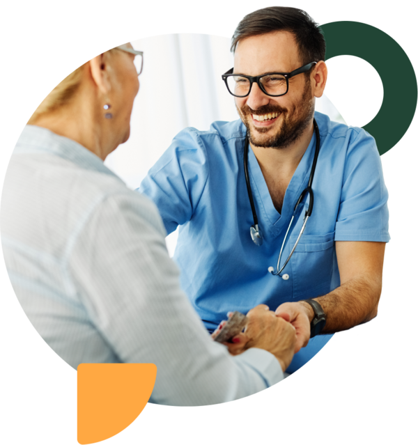 Smiling male nurse with patient