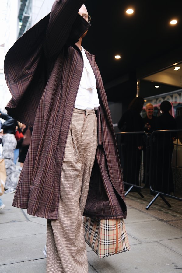 Guest attending the Chet Lo Spring/Summer London Fashion Week show.