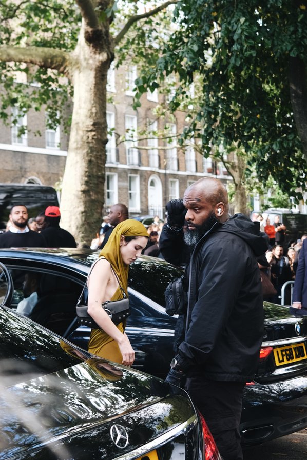 Guest attends the Burberry Spring Summer 2024 show during London Fashion Week