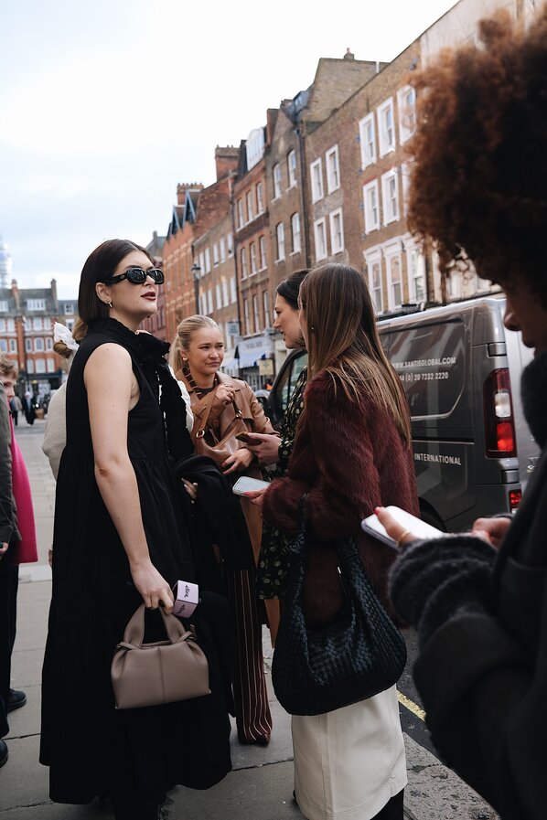 Guest attends the Burberry Spring Summer 2024 show during London Fashion Week