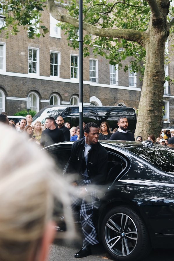 Micheal Ward attends the Burberry Spring Summer 2024 show during London Fashion Week.