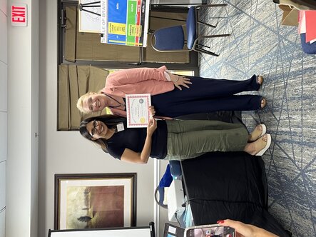 Amy Schneider and a student recieving their Silva Life & Intuition Certification
