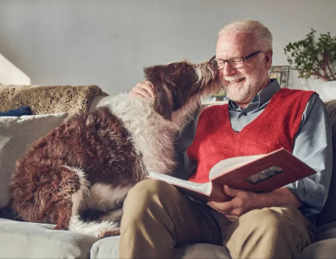 Photo of old man with a dog