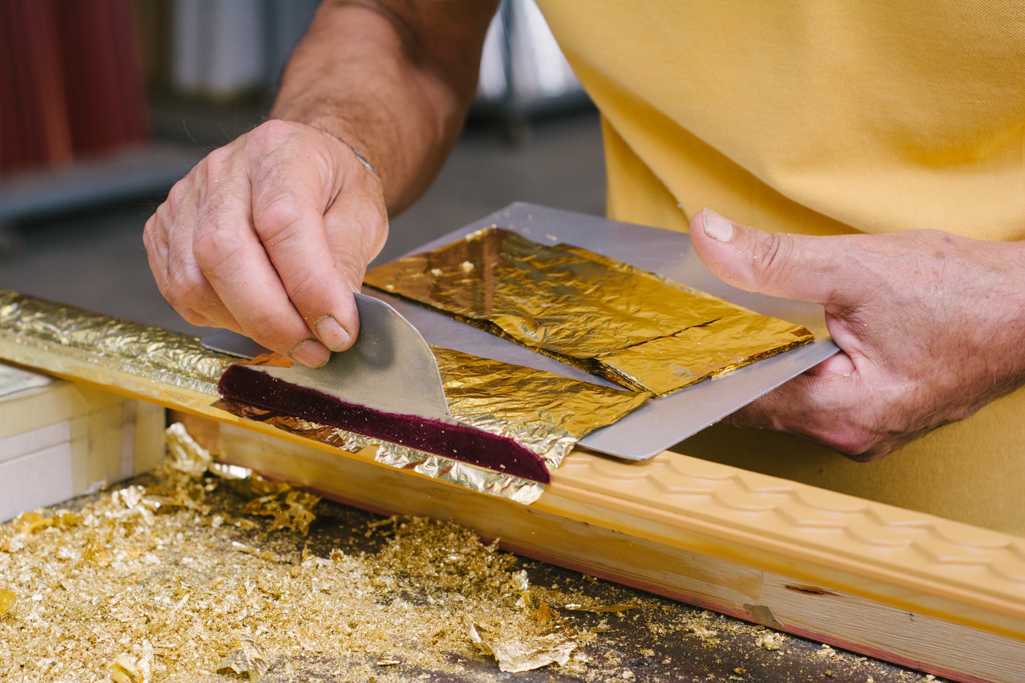 Moulding being gold-leafed