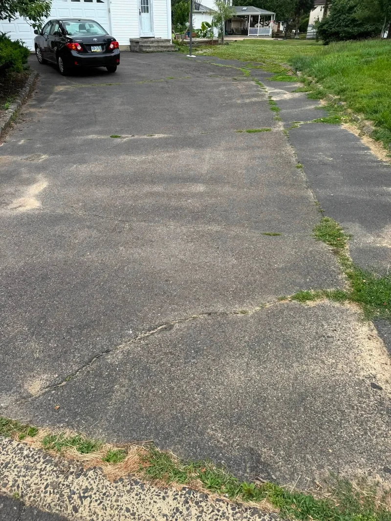 Driveway crack repair and sealing before PureSeal sealcoating