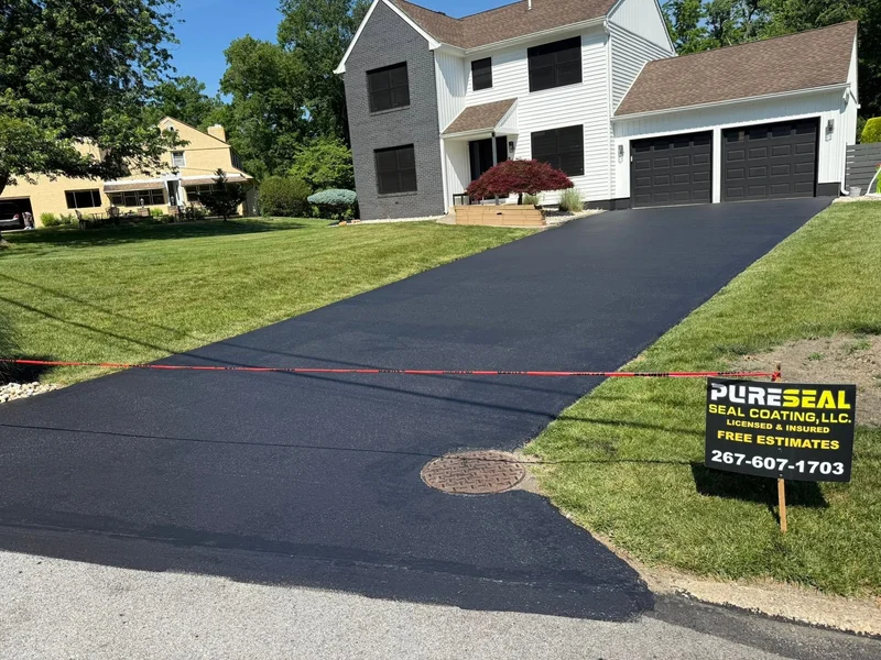Wide residential driveway sealcoating after PureSeal sealcoating
