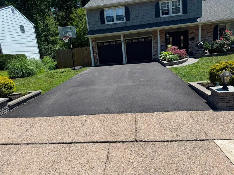 Paver-edged driveway sealcoating before PureSeal sealcoating
