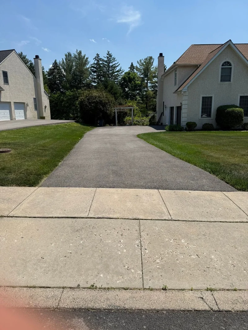 Curved driveway sealcoating before PureSeal sealcoating