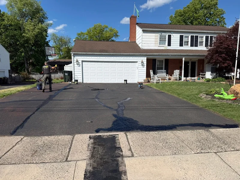 Townhome driveway sealcoating before PureSeal sealcoating