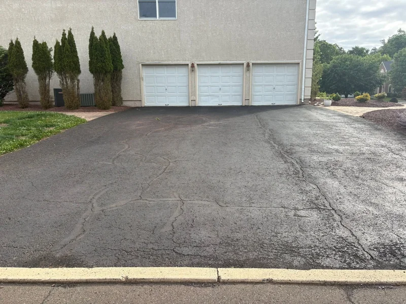 Three-car driveway restoration before PureSeal sealcoating