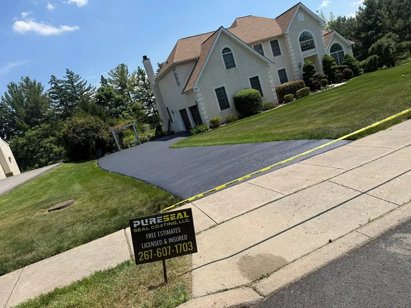 Curved driveway sealcoating after PureSeal sealcoating