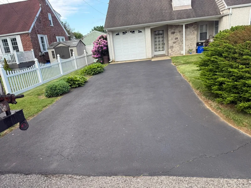 Paver-bordered driveway sealing before PureSeal sealcoating