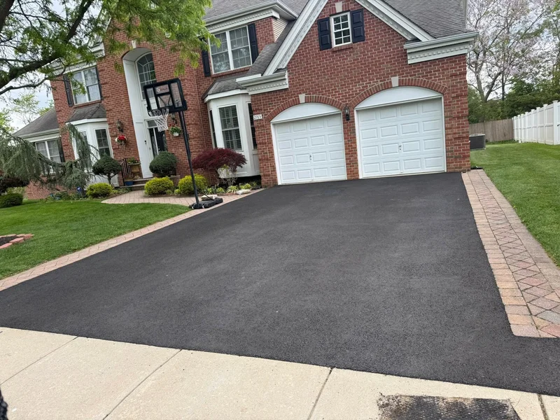 Paver-bordered driveway sealing after PureSeal sealcoating