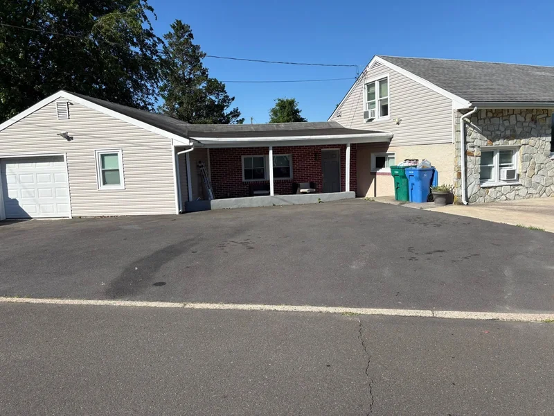 Courtyard driveway sealcoating before PureSeal sealcoating