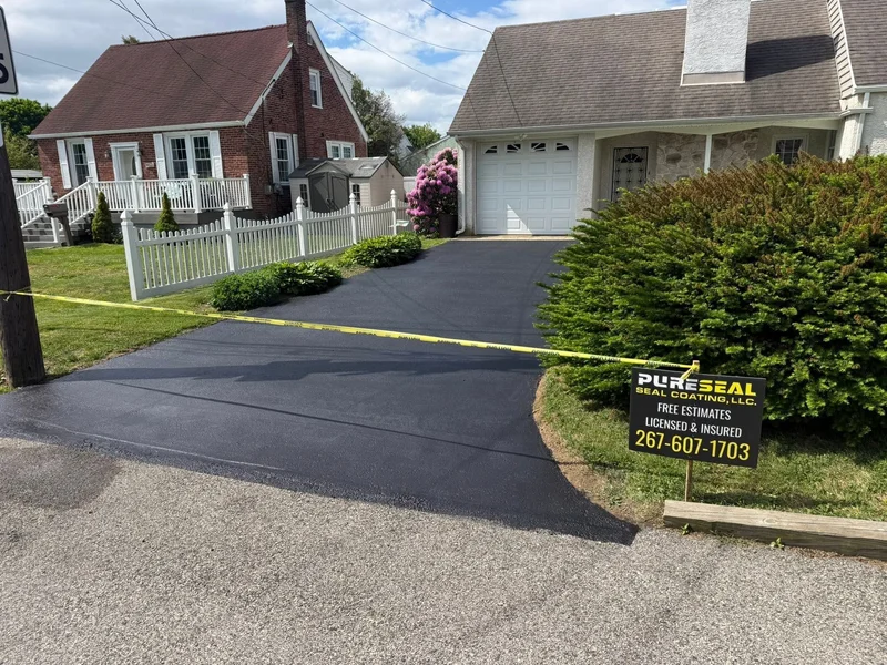 Brick home driveway refresh after PureSeal sealcoating