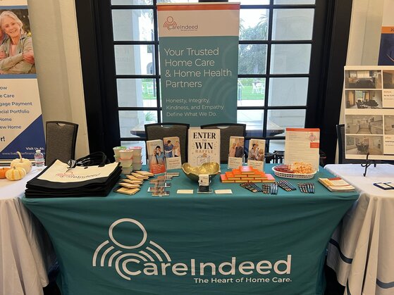 Care Indeed team welcoming visitors at the exhibitor booth