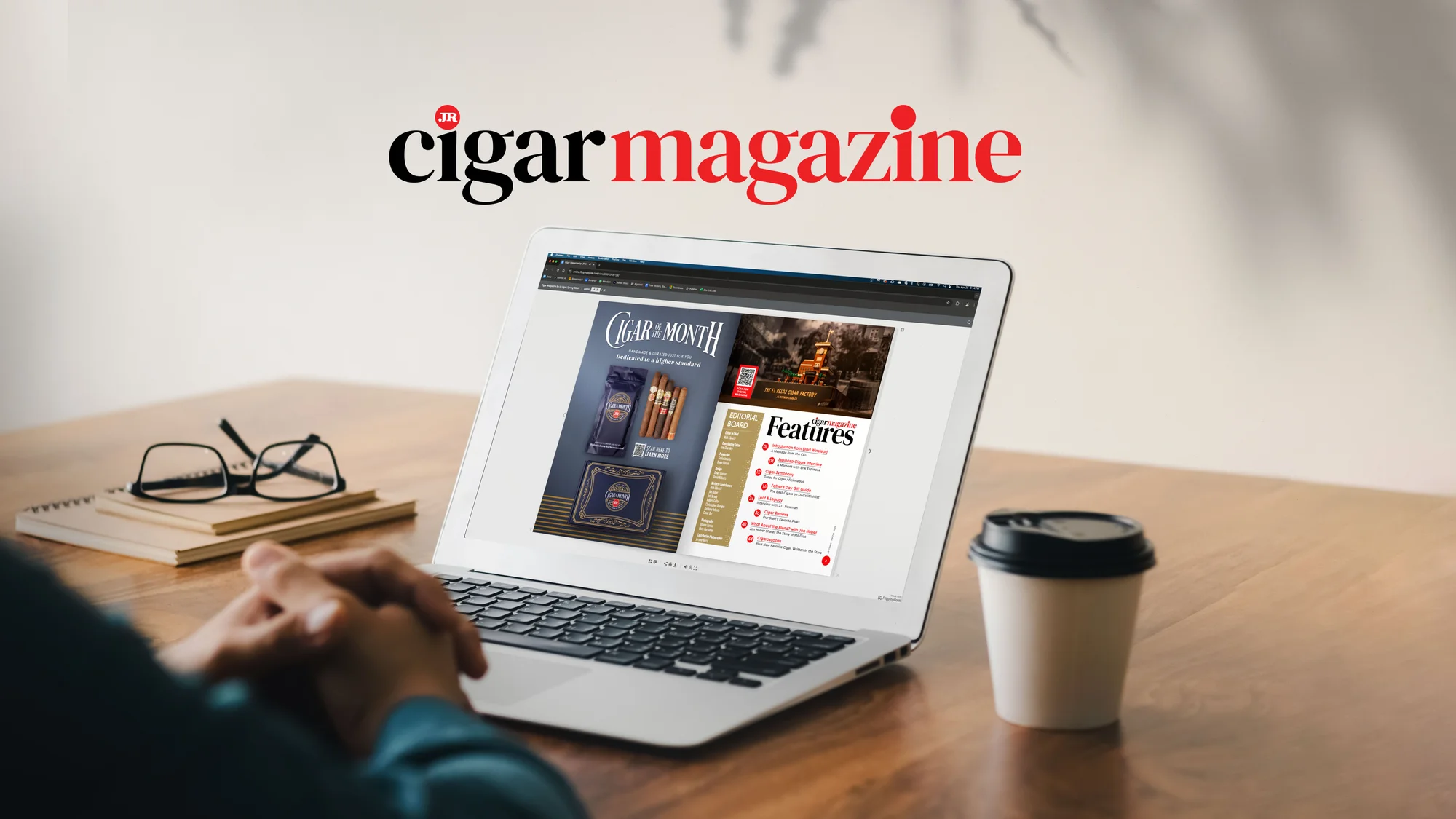 Open laptop with Cigar Magazine webpage open